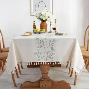 Floral embroidered cream linen tablecloth with tassels for rustic home dining decor