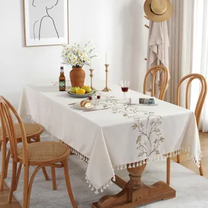 Elegant cream rectangular tablecloth with leaf embroidery and decorative fringes