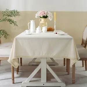 Minimalist beige linen rectangular tablecloth with decorative fringe tassels for home dining