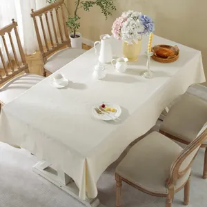 Creamy rectangular cotton linen tablecloth in a French minimalist dining room setting