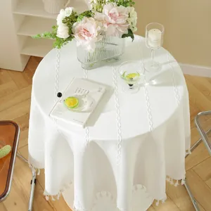 White minimalist round tablecloth with vertical jacquard texture and elegant fringe trim