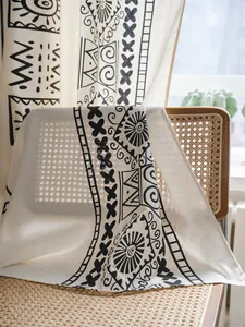 Detailed texture of bohemian cotton linen curtain with black geometric tribal patterns