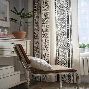 Bohemian linen cotton curtain with black geometric patterns in a cozy bedroom setting