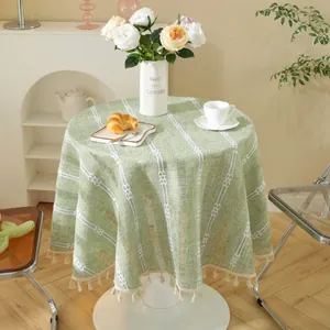 Green round tablecloth with white vertical stripes and fringe edges for home dining