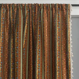Detail of bohemian cotton linen curtain with golden stripes and elegant fringe
