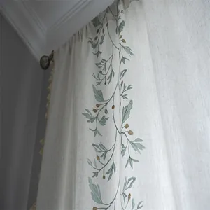 Ivory cotton linen curtain with green floral embroidery and decorative side tassels