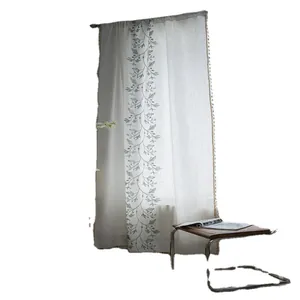 Off-white cotton linen curtain with green vine embroidery and tassel ball fringe trim