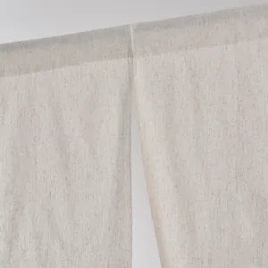 Detailed close-up of natural linen texture and pole pocket design on a split door curtain