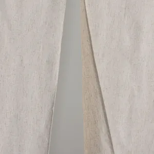 Close-up of minimalist beige cotton linen door curtain with textured fabric layers