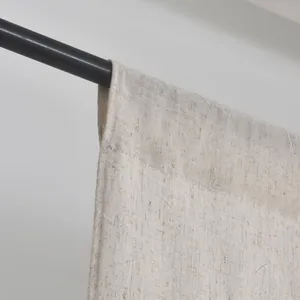 Detail of oatmeal linen door curtain with rod pocket and premium woven texture