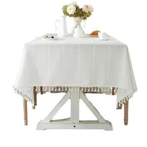 Minimalist white table cloth with jacquard patterns and elegant fringe tassels