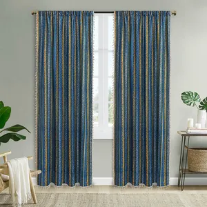 Detail of bohemian navy blue cotton linen curtains with gold stripes and cream tassels