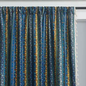 Detail of bohemian cotton linen curtain with colorful stripes and white tassels