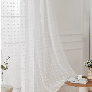 Detailed texture of white sheer curtain with soft pom-poms and polyester fabric
