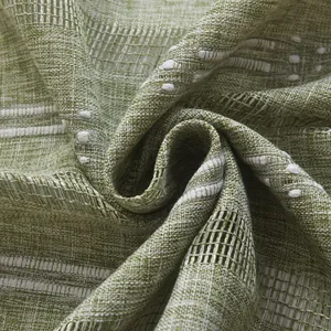 Macro shot of green and white jacquard curtain fabric with fine textured dots