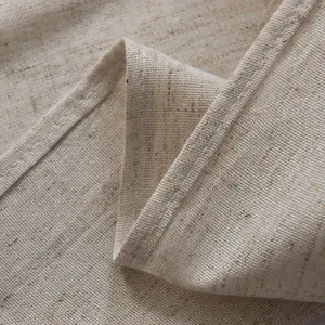 Detail of high-quality cotton linen fabric with precise stitching on natural beige door curtain