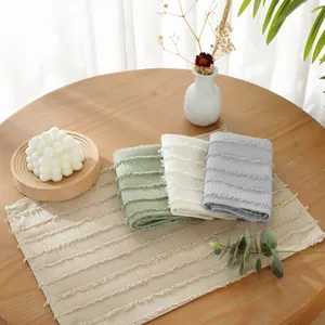 Minimalist polyester striped placemats in sage green and off-white for table decor
