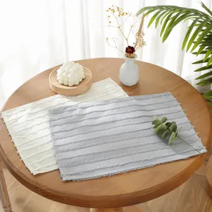 Minimalist rectangular placemats with fringe edge and texture in neutral tones