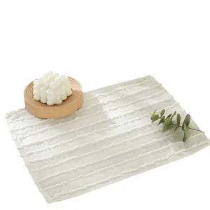 Minimalist beige rectangular placemat with decorative fringe and textured stripes