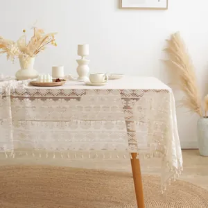 Beige boho lace tablecloth with vintage floral patterns and tassels for dining decor