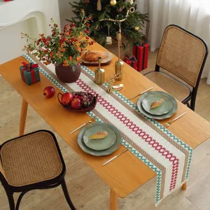 Christmas table runner with red geometric circles and green waves on beige linen cotton