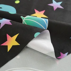 Macro detail of Halloween tablecloth fabric with purple ghosts and pumpkin star patterns