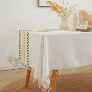 Nordic cream linen tablecloth with green leaf print and elegant beige tassel edges