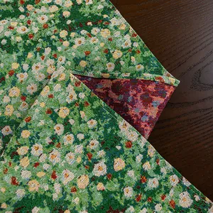 Detail of double-sided floral jacquard tablecloth fabric with thick woven texture