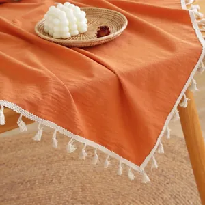 Pompoen oranje katoenen linnen tafelkleed met witte kwastjes voor modern huis