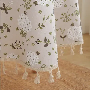 Rustic floral linen round tablecloth with green vines and elegant tassel edges