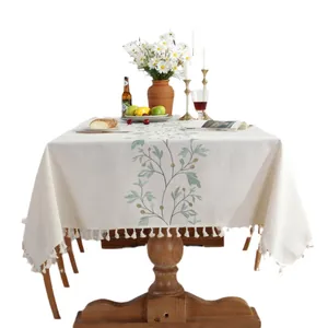 White rectangle linen tablecloth with leaf embroidery and decorative white tassels