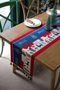 Detailed texture of Christmas table runner with festive deer and tassel fringe trim