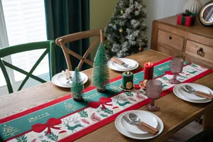 Detail of Christmas table runner with embroidered reindeer, snowflakes and tassels