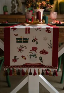 Detailed Christmas table runner with snowman jacquard patterns and decorative tassels