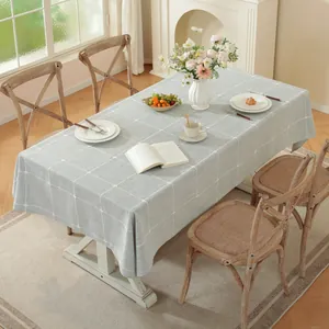 Mantel gris de lino con cuadros y borlas para mesa de comedor rectangular
