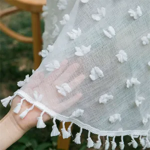 White round mesh tablecloth with tufted dots and fringe tassels for outdoor wedding events