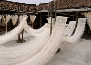 Macro detail of high quality natural white linen fibers drying in a traditional courtyard