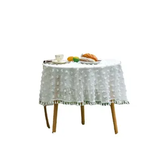 White round tablecloth with floral embroidery and tassel fringe for outdoor weddings