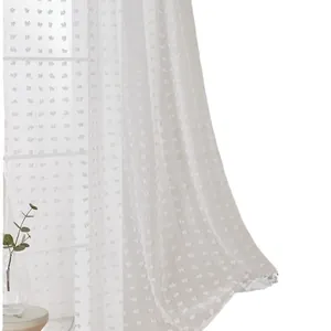 White semi-transparent sheer curtain with tufted pom-poms and minimalist home decor