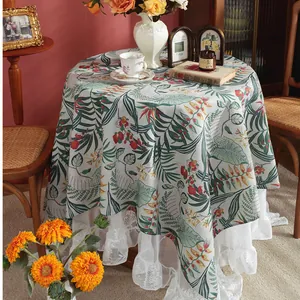 Tropical leaf and floral print round linen tablecloth with white lace edges for dining