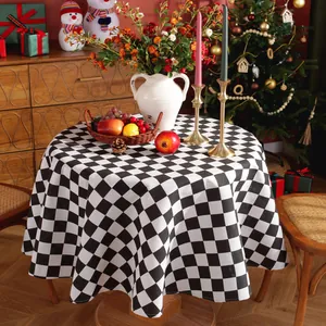 Close-up of black and white checkered round tablecloth with high-quality thick fabric texture