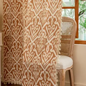 Detail of European retro geometric print curtain with fringe tassels and linen texture