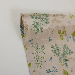 Close-up of rod pocket header and double stitching on floral linen blend cafe curtain