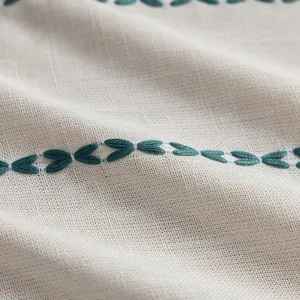 Macro shot of striped polyester fabric texture with high-quality embroidery details