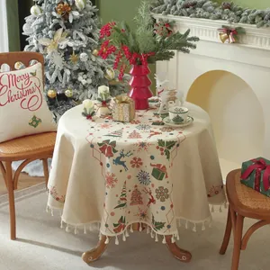Red Christmas round tablecloth with fringe, featuring reindeer and tree patterns