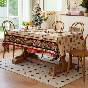 Close-up of thick jacquard Christmas tablecloth with snowflake and deer patterns