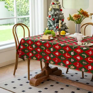 Detailed close-up of festive jacquard tablecloth with red and green nutcracker patterns