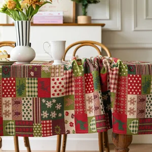 Thick jacquard Christmas tablecloth featuring festive reindeer, snowflakes and plaid patterns
