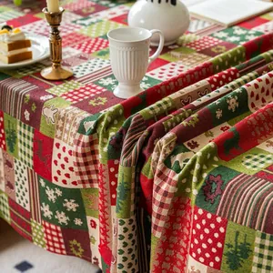 Close-up of thick jacquard Christmas tablecloth with reindeer and snowflake patterns