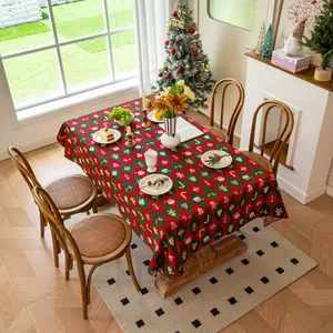 Detail of thickened jacquard Christmas tablecloth with festive patterns on wood table
